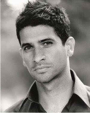 Raza Jaffrey in a black shirt.